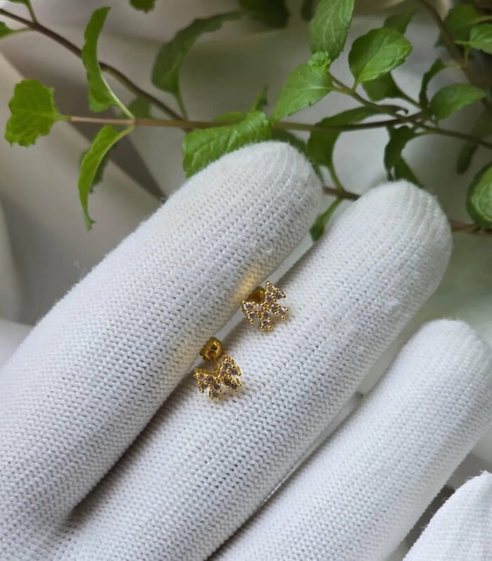 Twinkle Bow Gold Ear Piercing